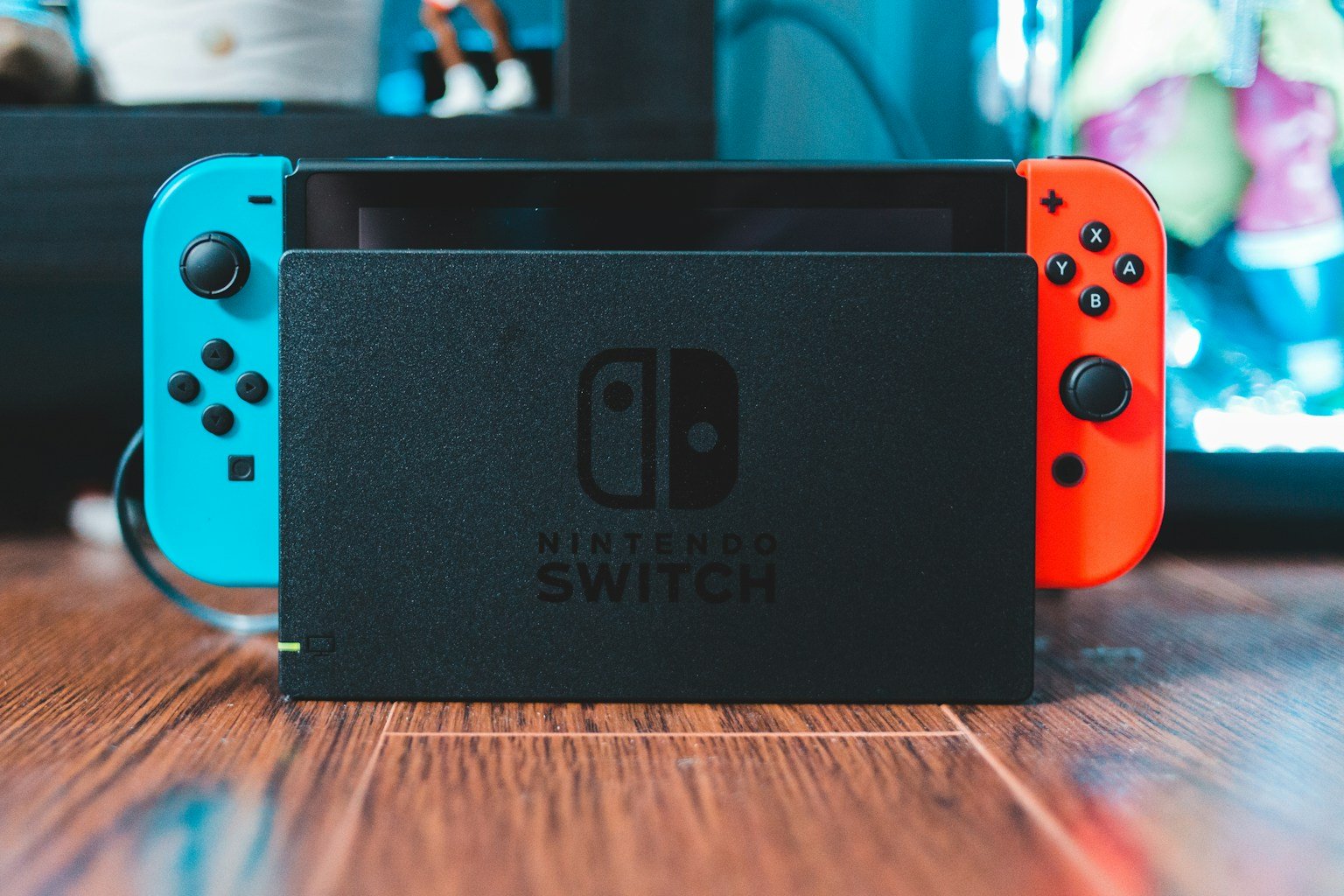 Nintendo Switch console with neon blue and red Joy-Con controllers attached